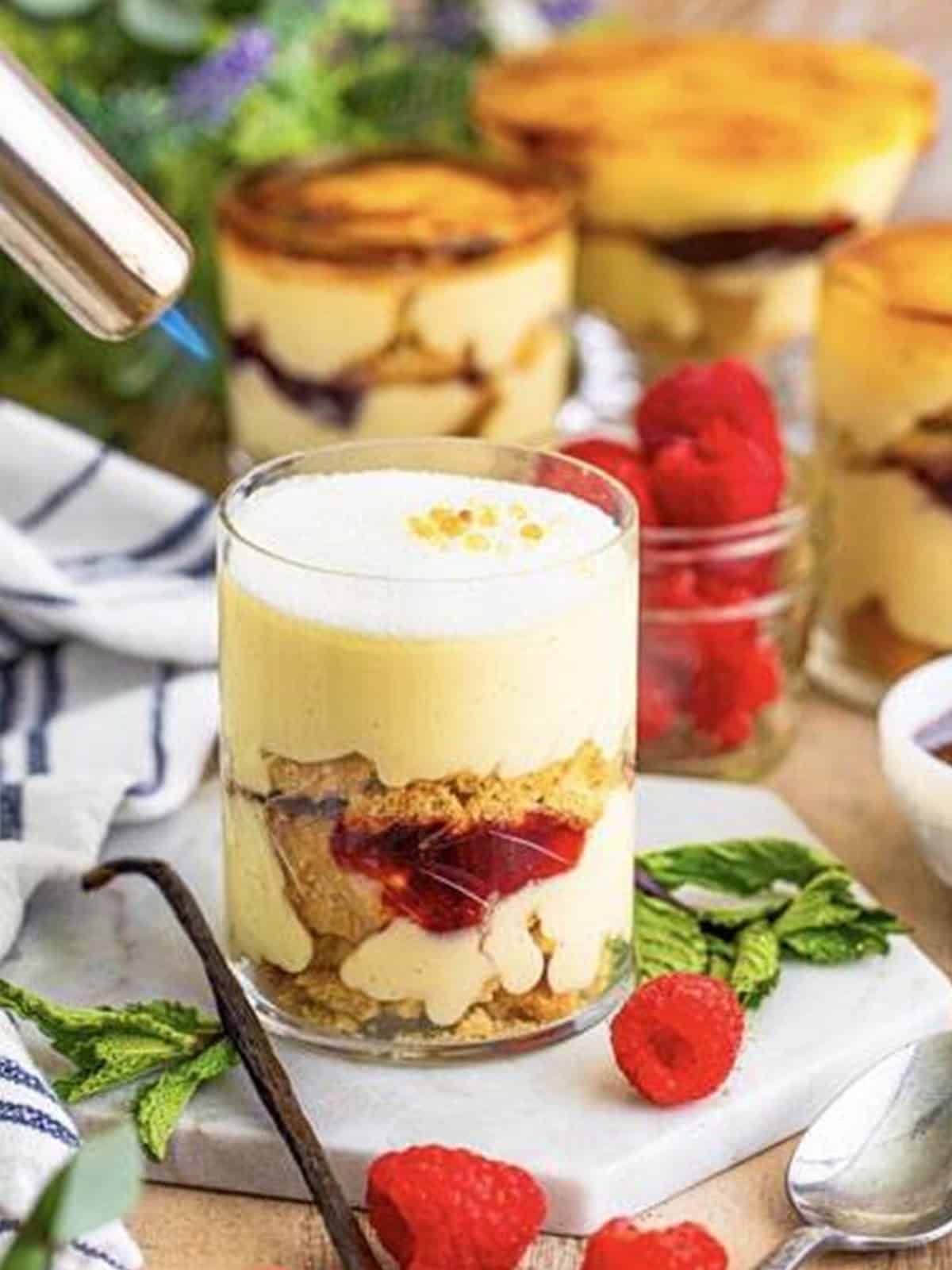 Torching the sugar topping on a mini trifle until browned like creme brulee.