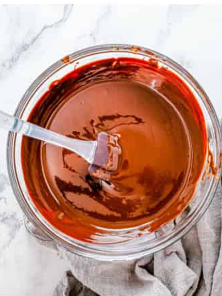Butter and semi sweet chocolate melted glossy in a bowl for the brownie batter.