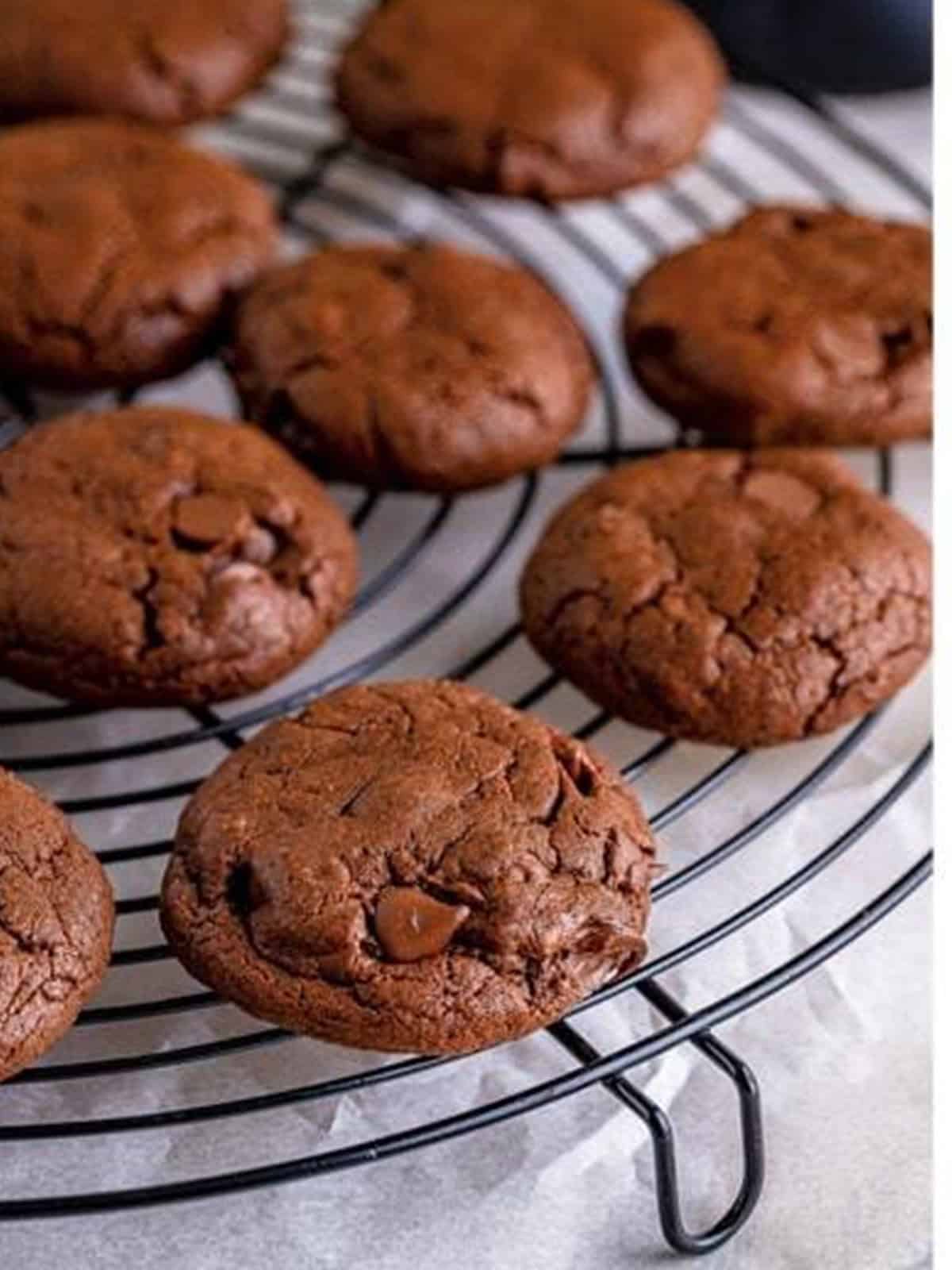 Baked mudslide chocolate cookies cooling on a wire rack.