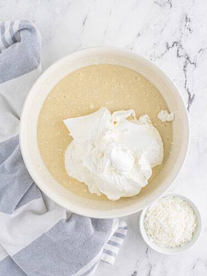 Whipped topping added to the coconut cream cheese mixture.