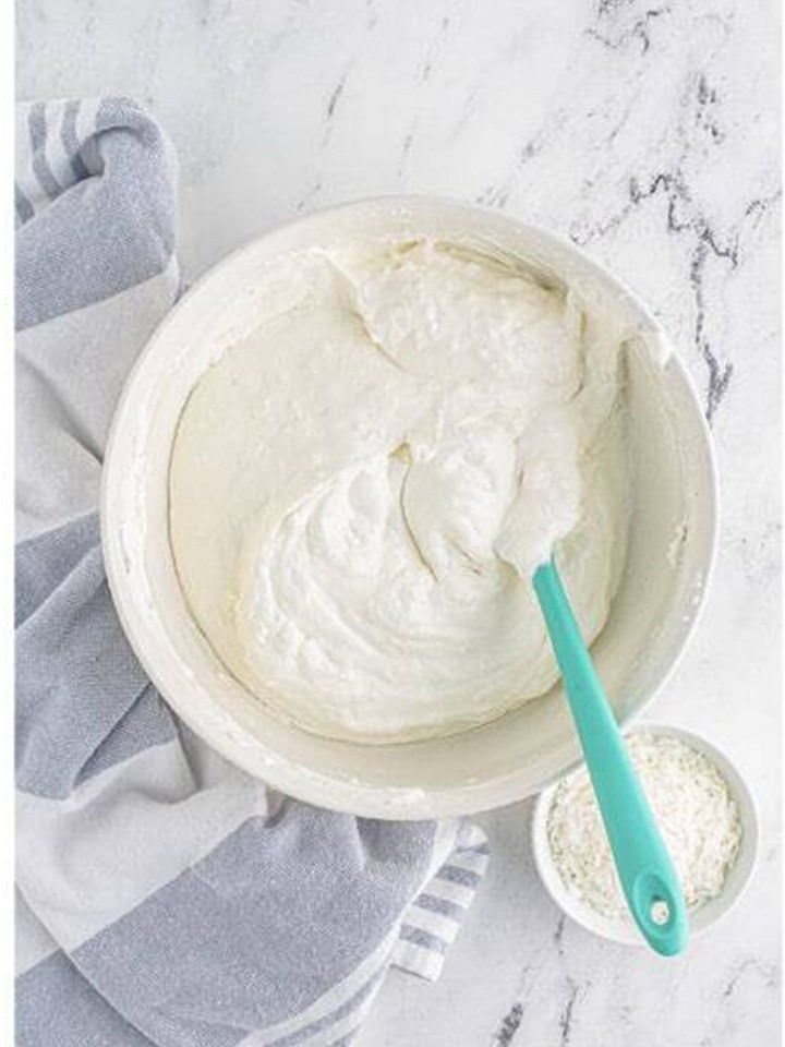 The whipped topping folded fully into the coconut cream pie filling.