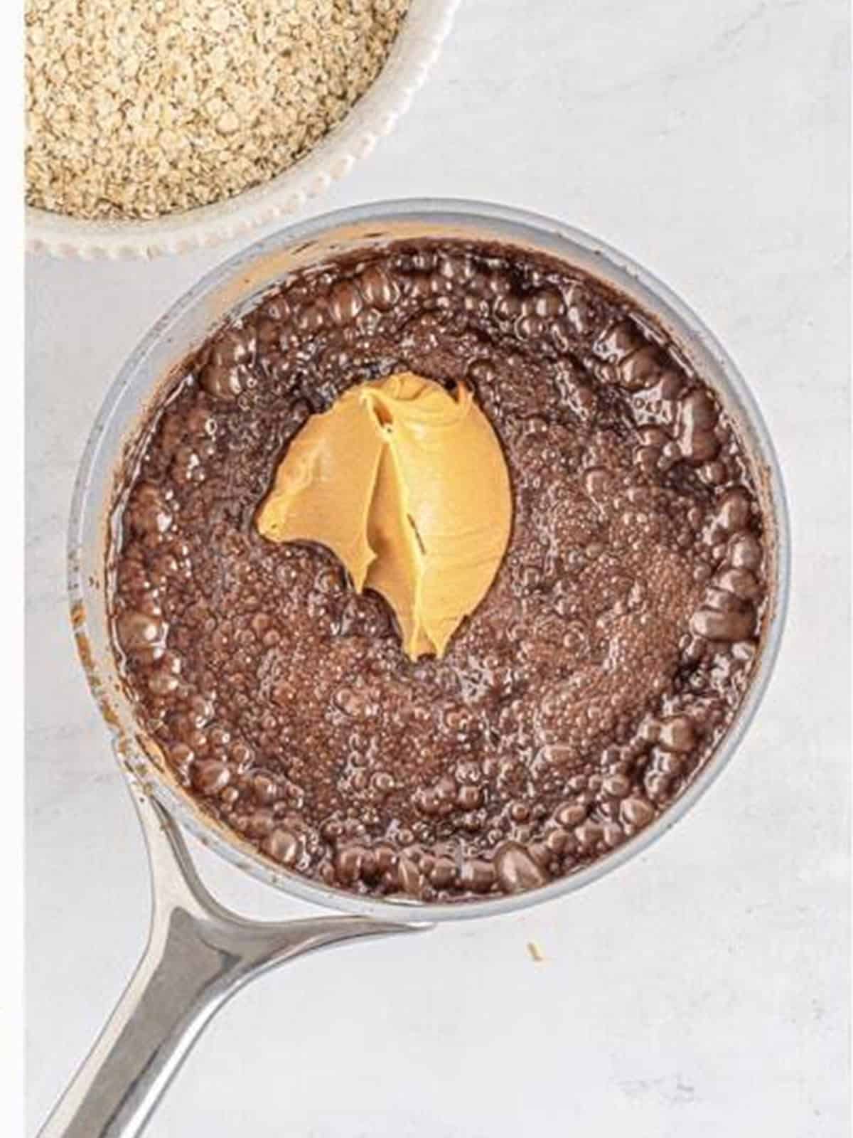 Creamy peanut butter added to the hot chocolate mixture off the heat.