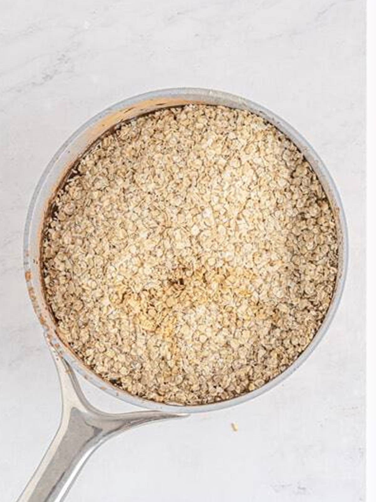 Quick oats and vanilla added to the saucepan of chocolate peanut butter mixture.