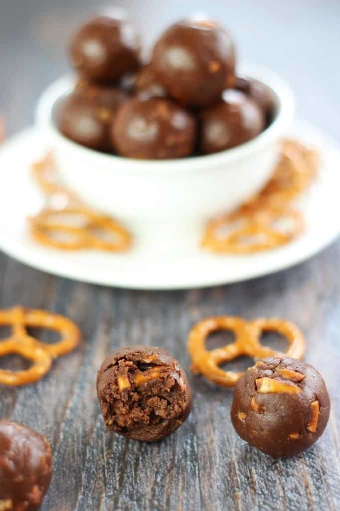 Nutella truffles with one broken open showing the fudgy pretzel filling.
