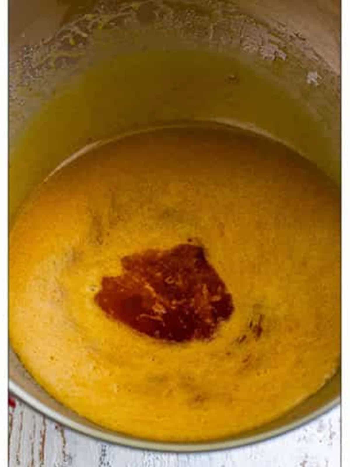 Reserved peach syrup and vanilla added to the creamed batter