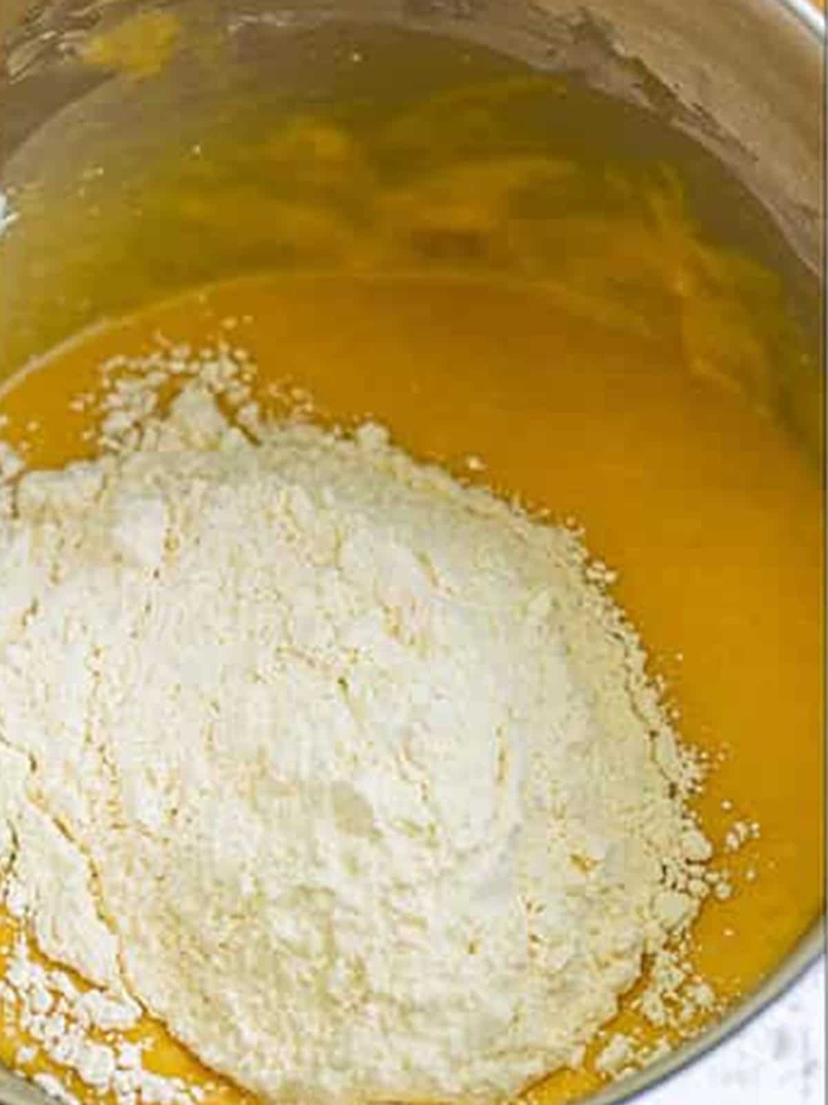 Half of the cake flour mixture added to the wet batter