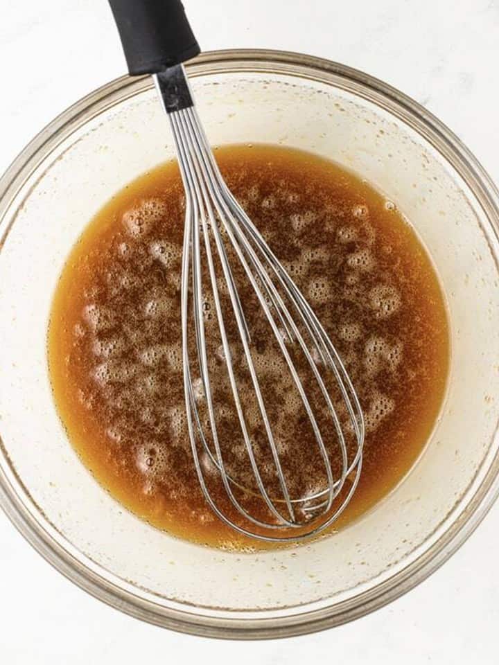 Brown sugar, maple syrup, melted butter, eggs, and vanilla whisked together for the pecan pie topping.