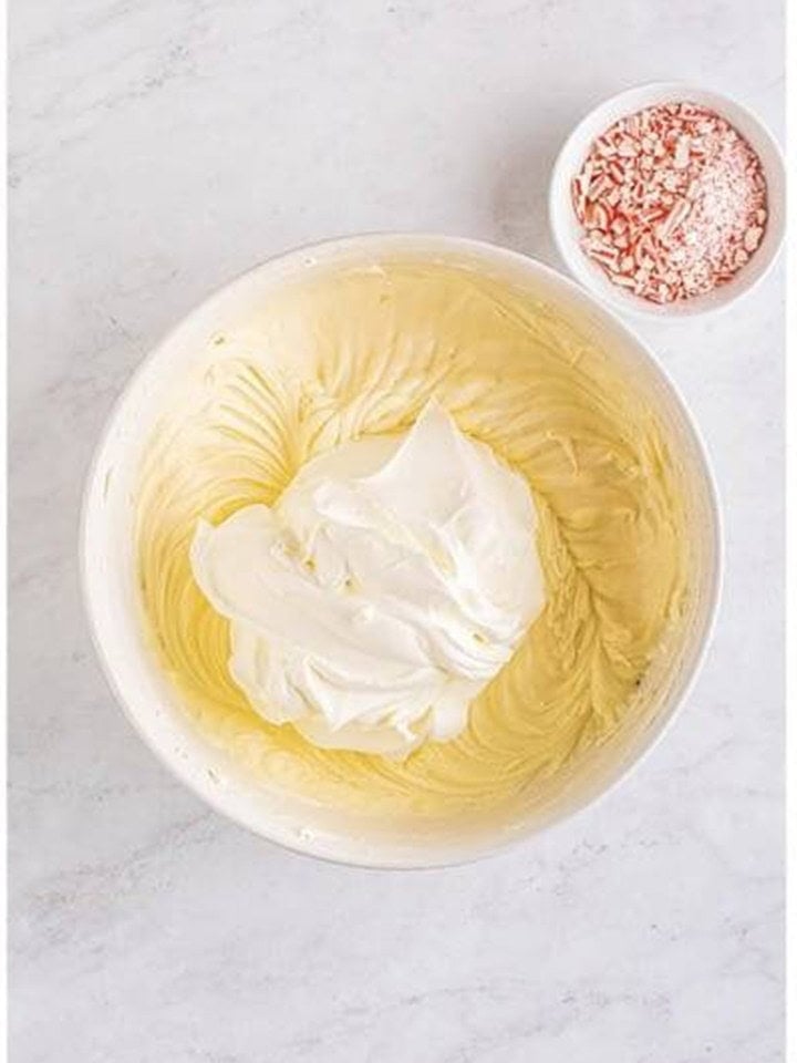 Whipped cream folded into the cream cheese mixture for the no bake peppermint cheesecake filling.