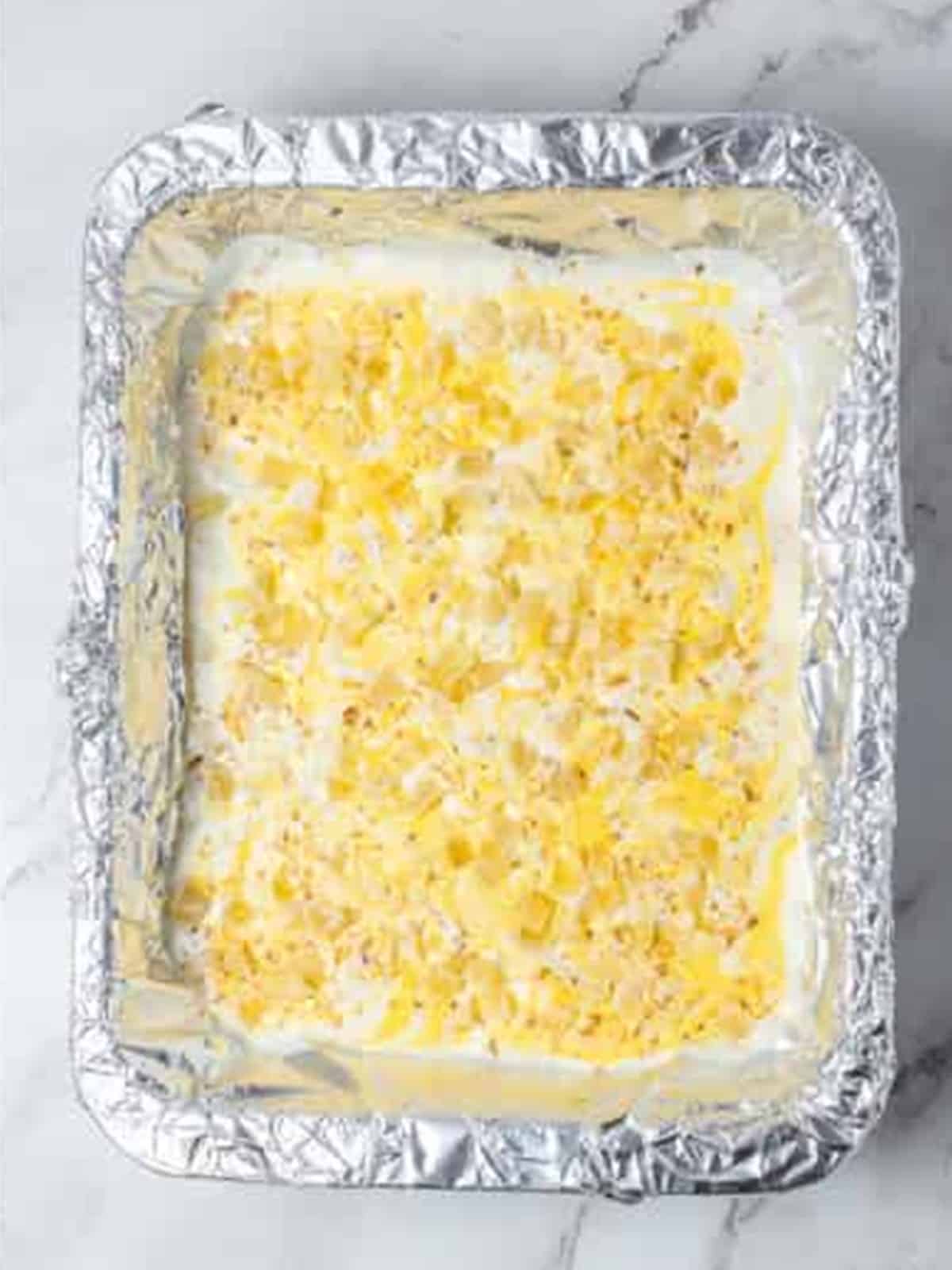 Toasted coconut and dried pineapple garnish sprinkled over the swirled bark before setting.