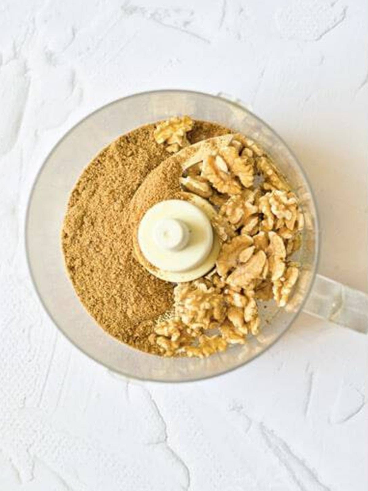 Walnuts and brown sugar in a food processor for the crumble topping.
