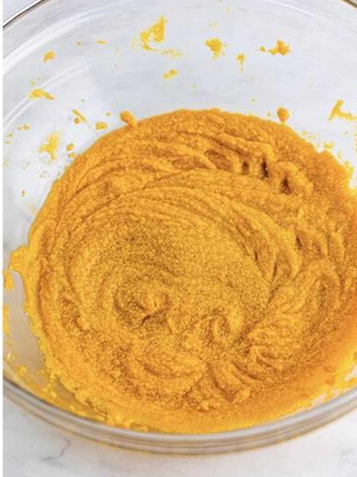 Butter, brown sugar, granulated sugar, pumpkin puree, and vanilla creamed until smooth in a glass bowl.