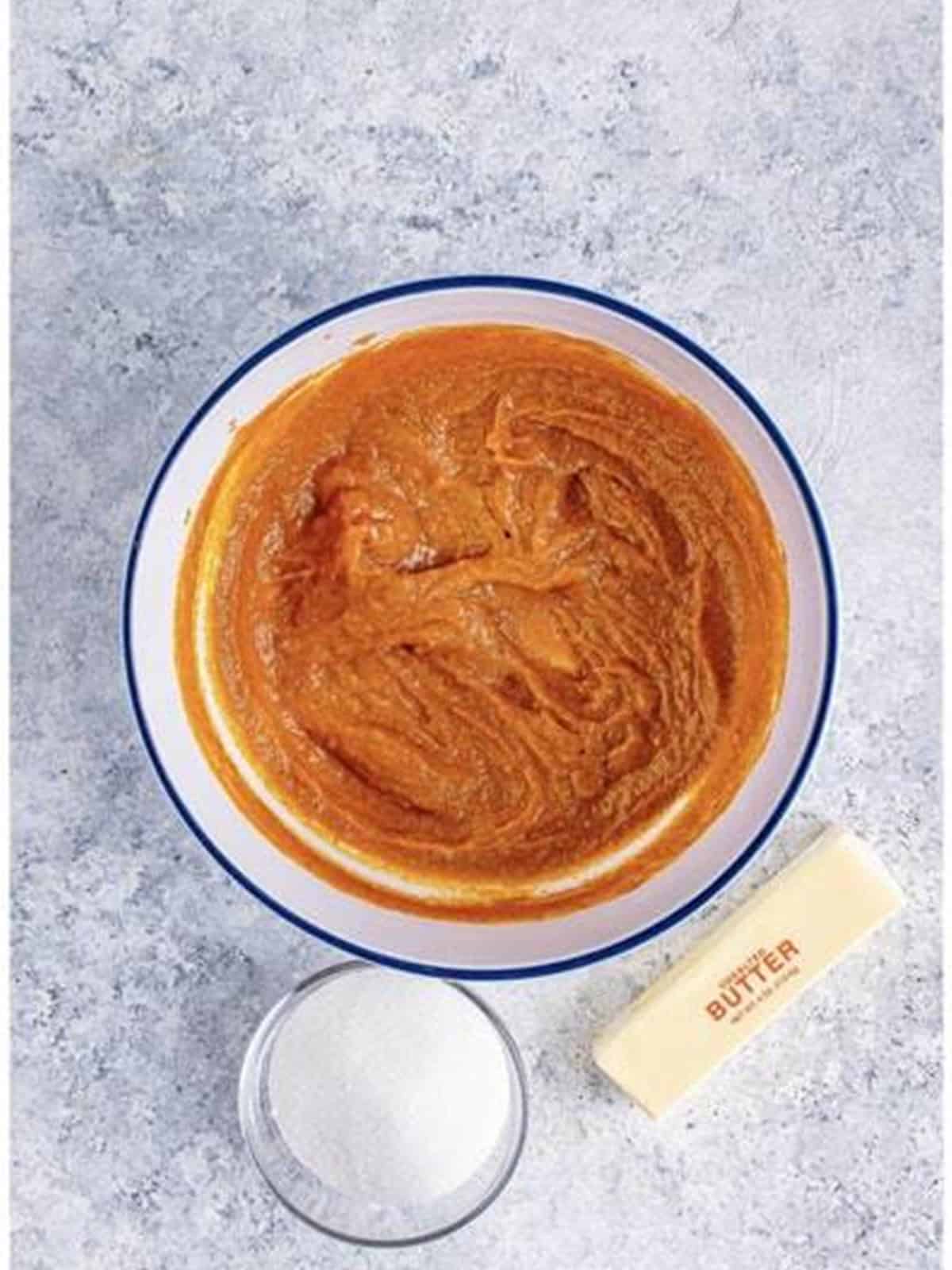 Pumpkin filling whisked smooth in a mixing bowl.