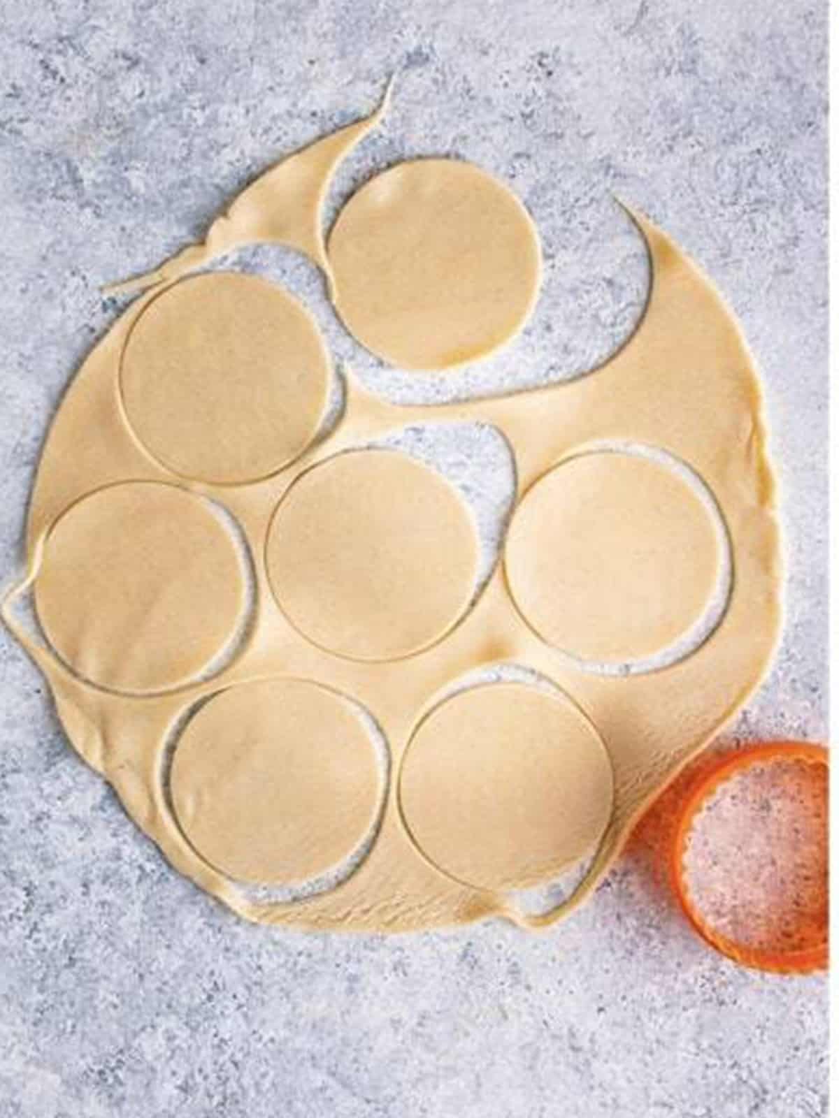Circles cut out of rolled pie crust dough.