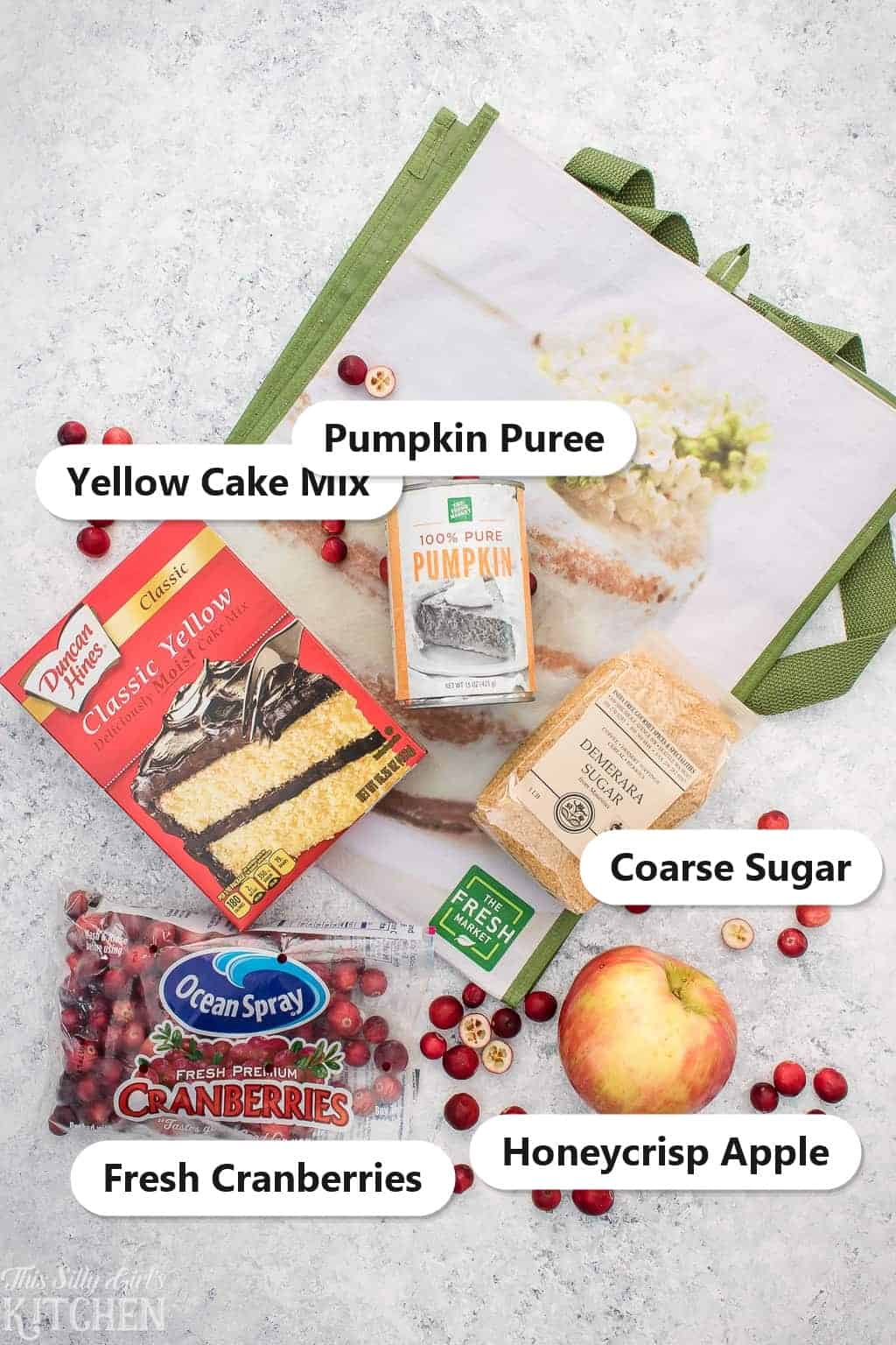 Labeled ingredients for Pumpkin Muffins including yellow cake mix, pumpkin puree, fresh cranberries, Honeycrisp apple, and coarse sugar.