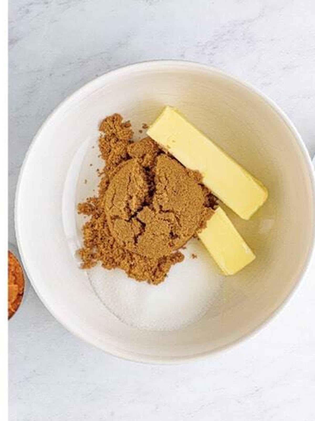 Butter, dark brown sugar, and granulated sugar in a mixing bowl.
