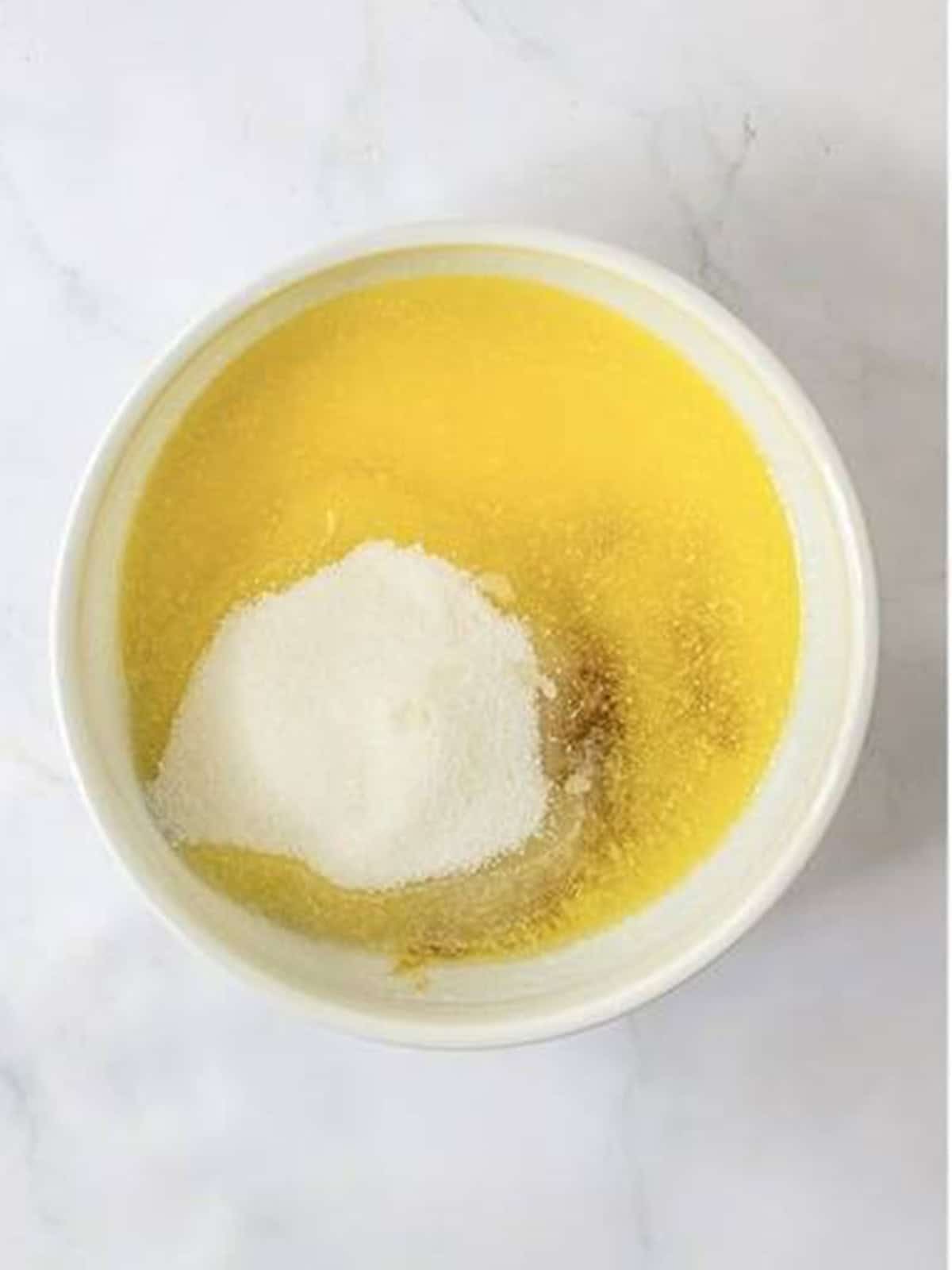Melted butter, brown sugar, and granulated sugar in a mixing bowl.