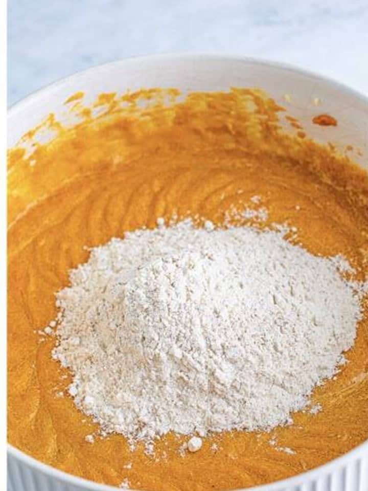 Dry ingredients added to the pumpkin batter for Pumpkin Whoopie Pies.