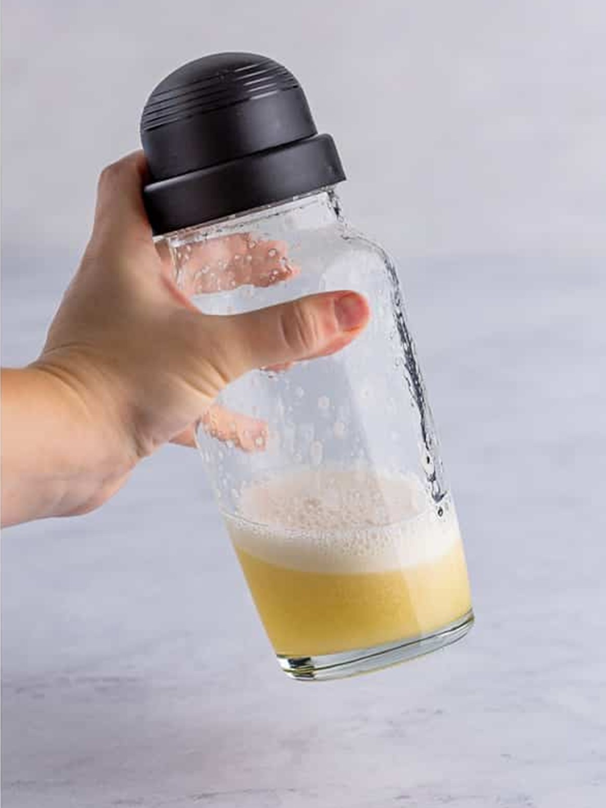 Dry shaking the rum sour so the egg white builds a foam.