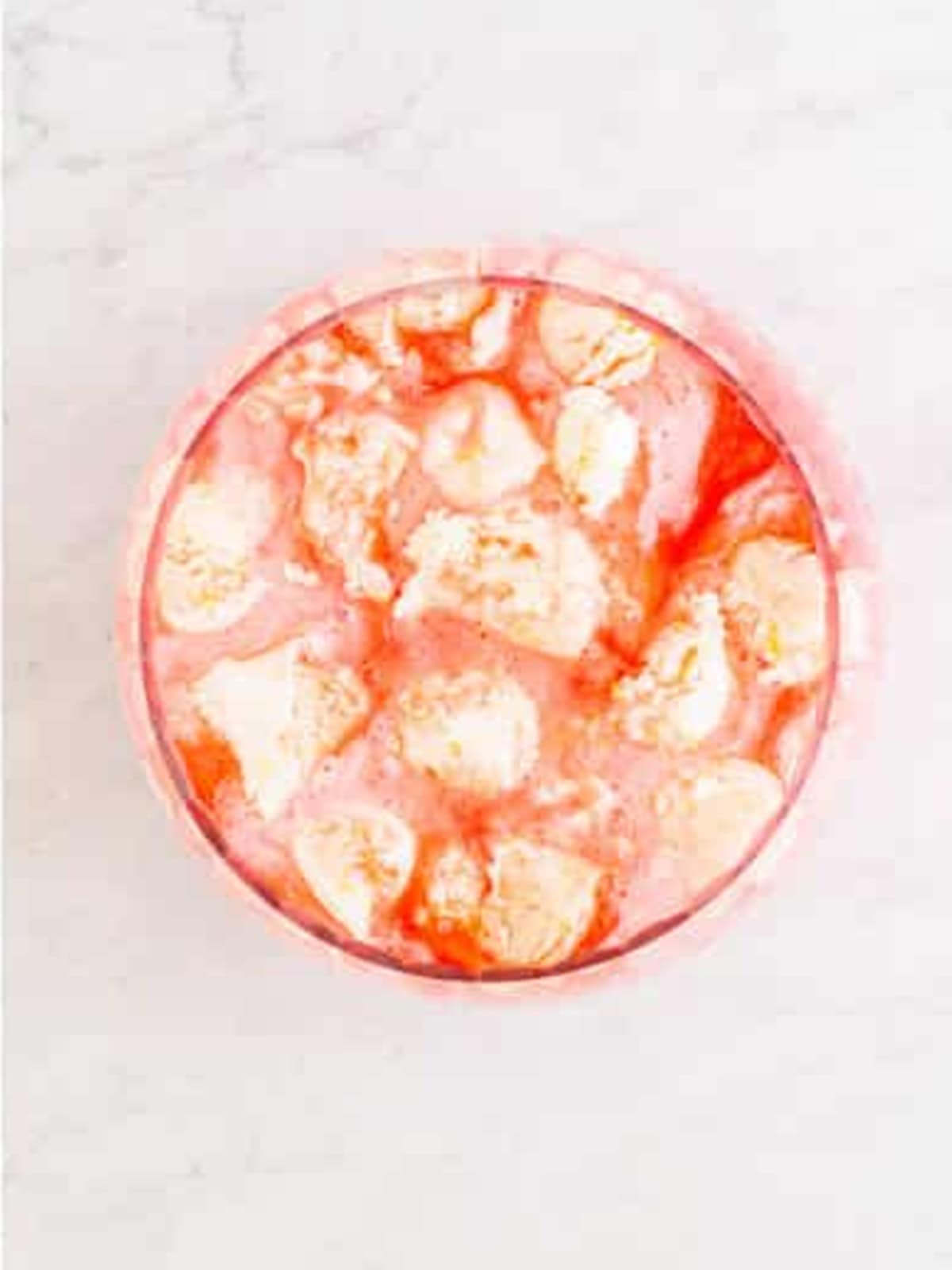 Scoops of pineapple sherbet floating on top of the Sherbet Punch.