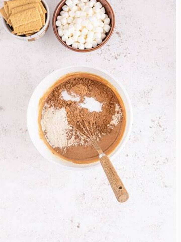 Cocoa powder and flour added to the smores brownie batter.