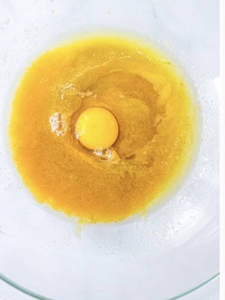 Egg and vanilla stirred into the brown sugar mixture.