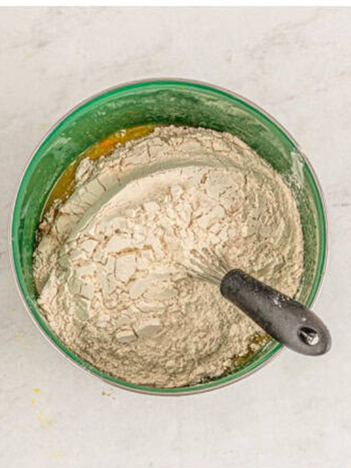 The dry flour and spice mixture added to the wet bundt cake batter.