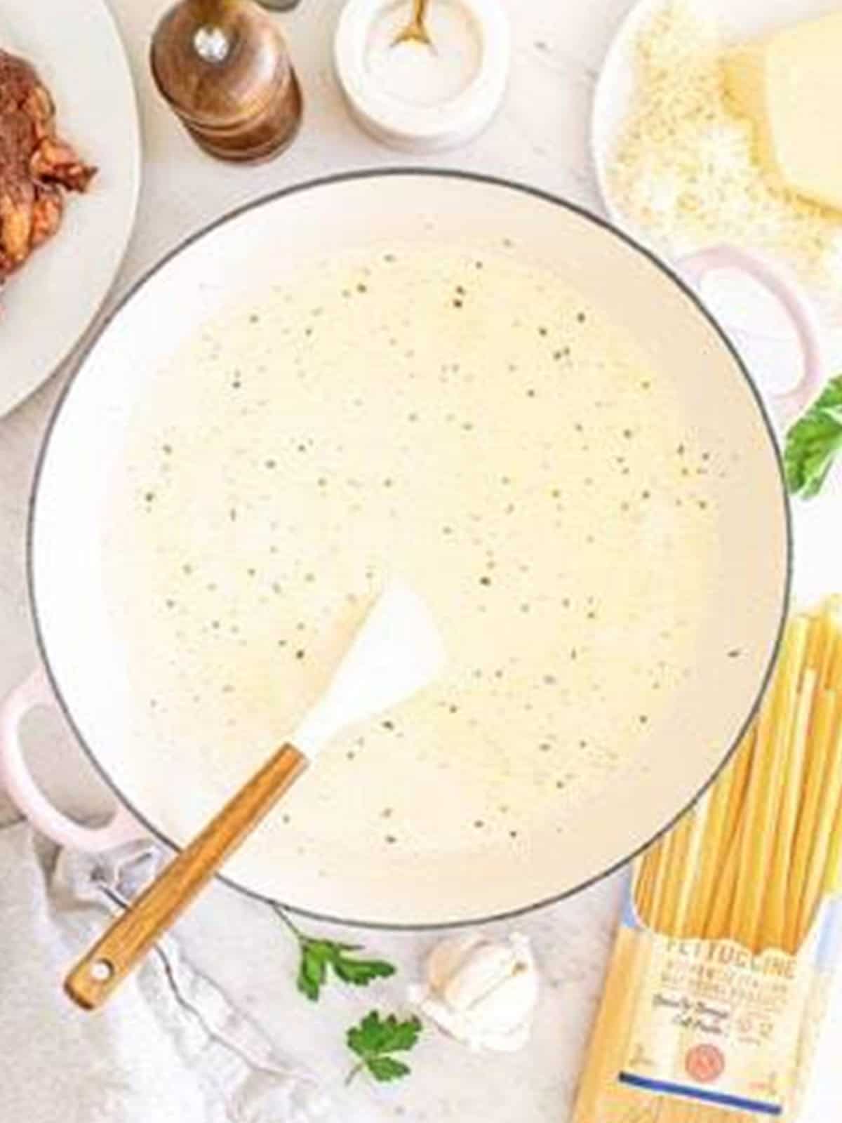Parmesan cheese whisked into the alfredo sauce until thick for Steak Alfredo.