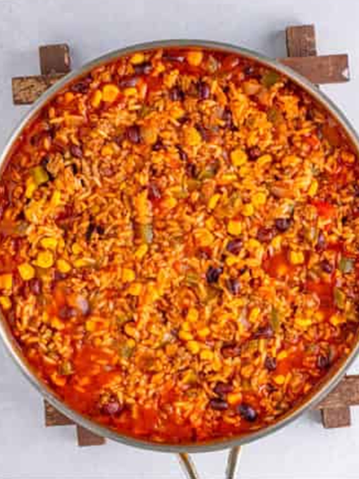 Mexican rice casserole simmered in the skillet until the rice is tender