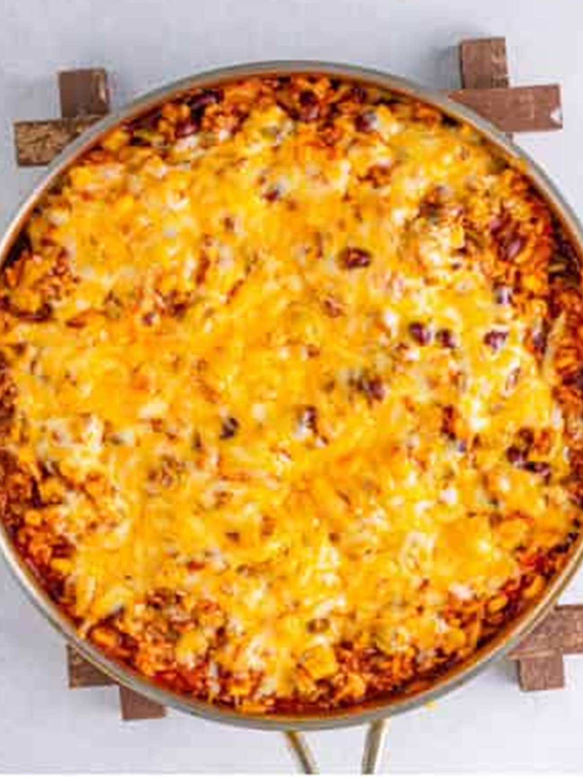 Shredded cheese melted over the top of the finished Mexican rice casserole