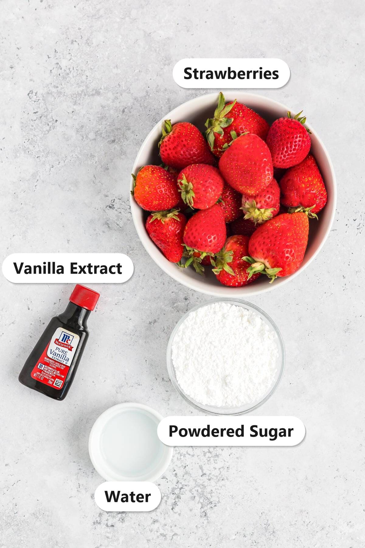 Labeled ingredients for Strawberry Sauce: fresh strawberries, powdered sugar, water, and vanilla extract.