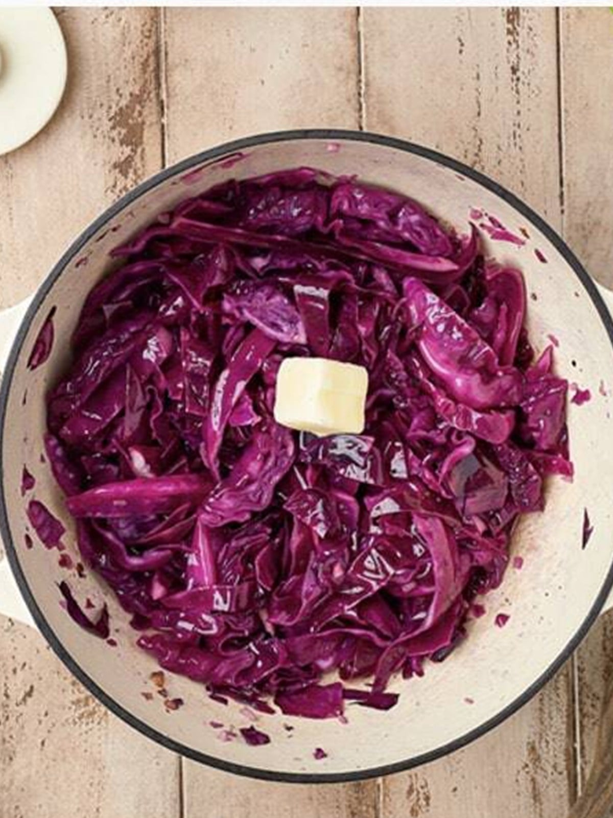 A pat of butter stirred into tender sweet and sour cabbage before serving.