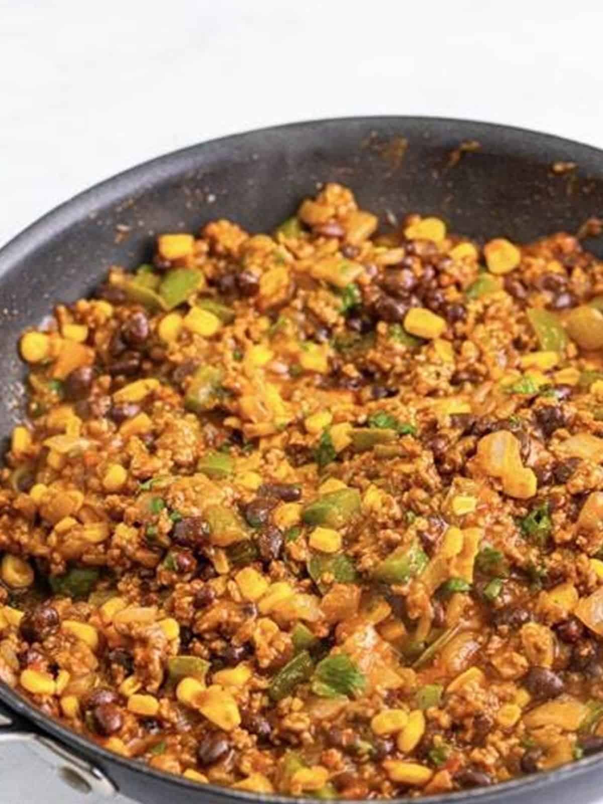 The finished saucy Taco Joes filling ready to spoon onto burger buns.