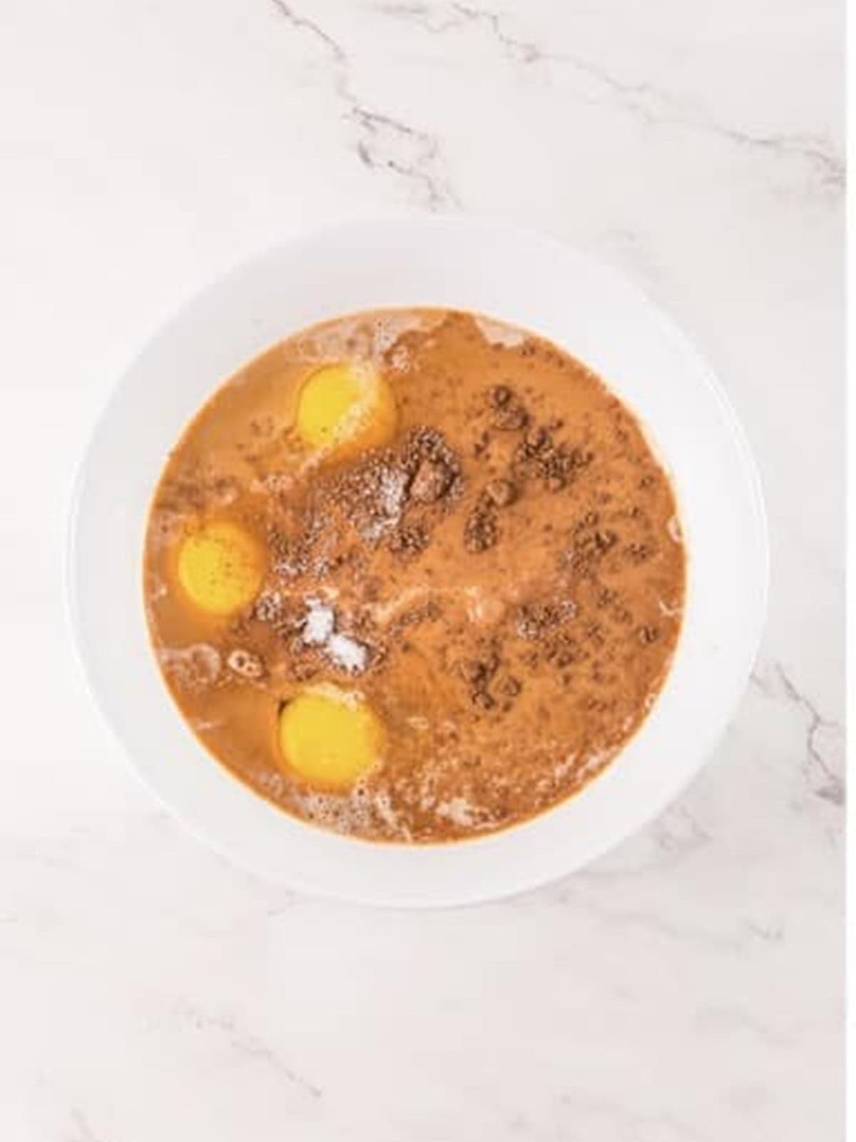 Whisking milk, eggs, brewed coffee, and cocoa into a custard for Tiramisu French Toast.