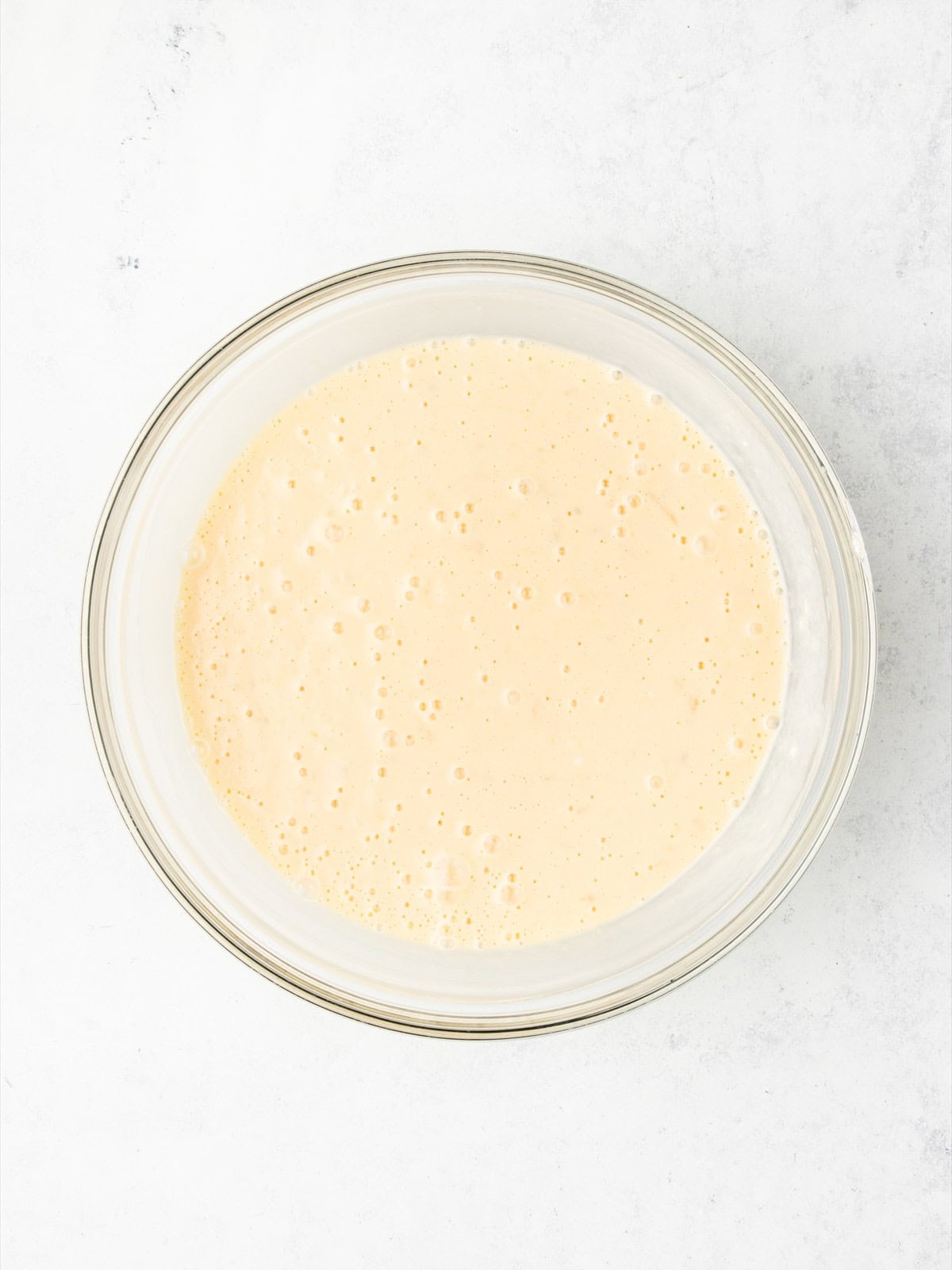Eggs, cream cheese, Greek yogurt and sugar beaten into the mashed banana until the cheesecake filling is smooth.