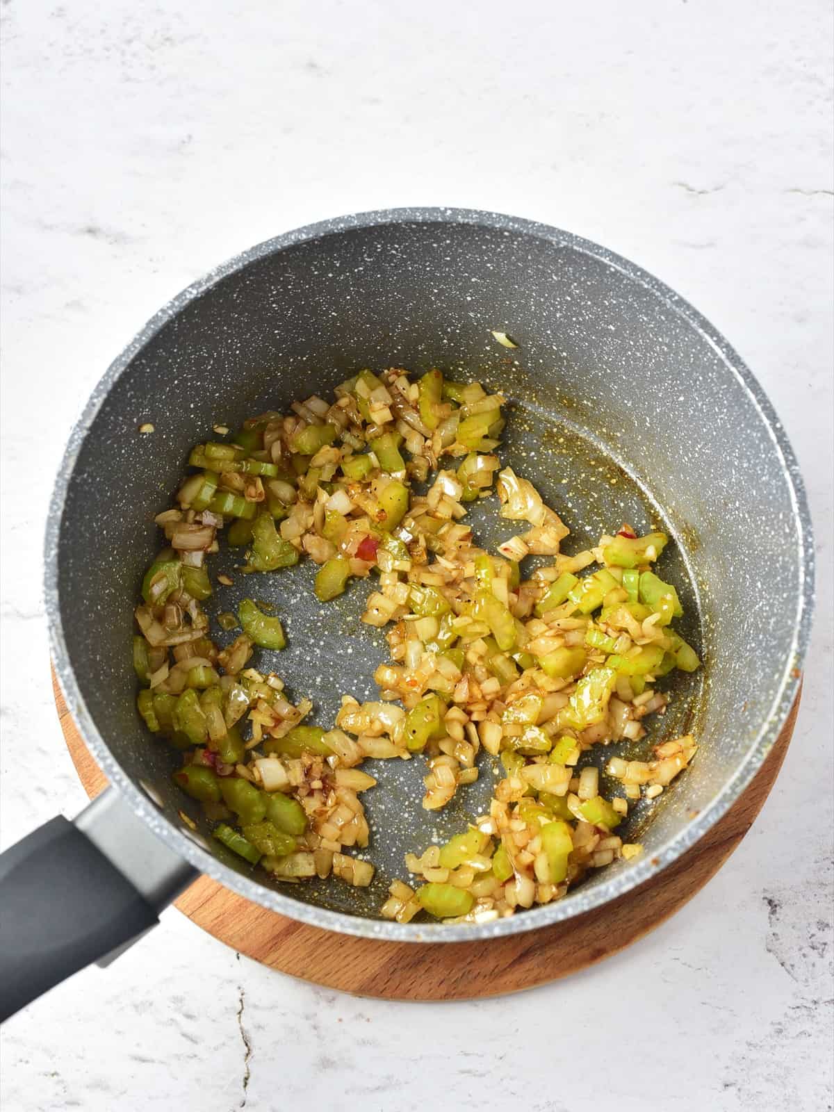 Seasonings, Worcestershire sauce and hot sauce stirred into the softened vegetables for clam chowder.