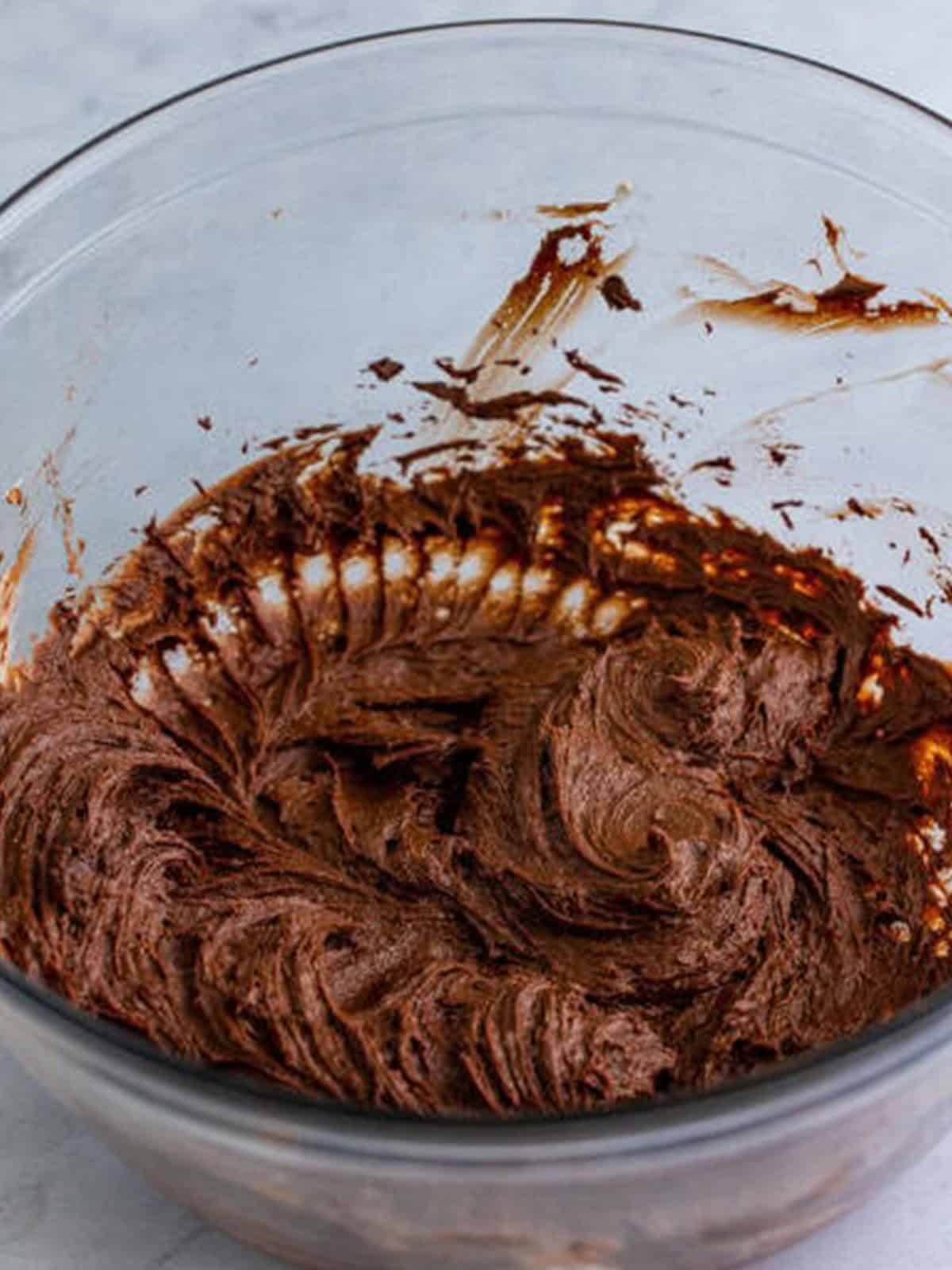 Hot cocoa mix beaten into the cream cheese until a thick chocolate base forms.