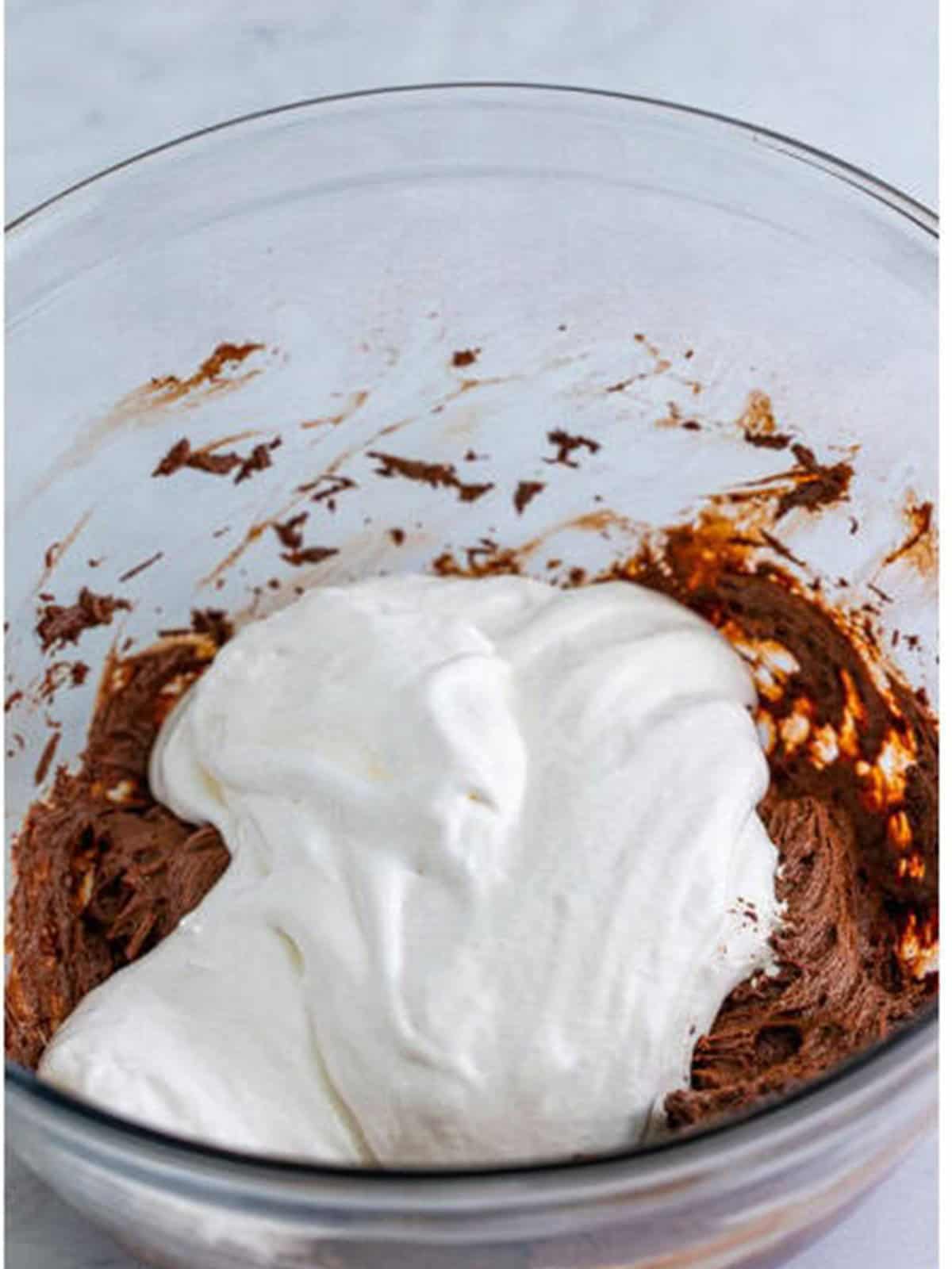 Marshmallow creme added on top of the chocolate cream cheese mixture.