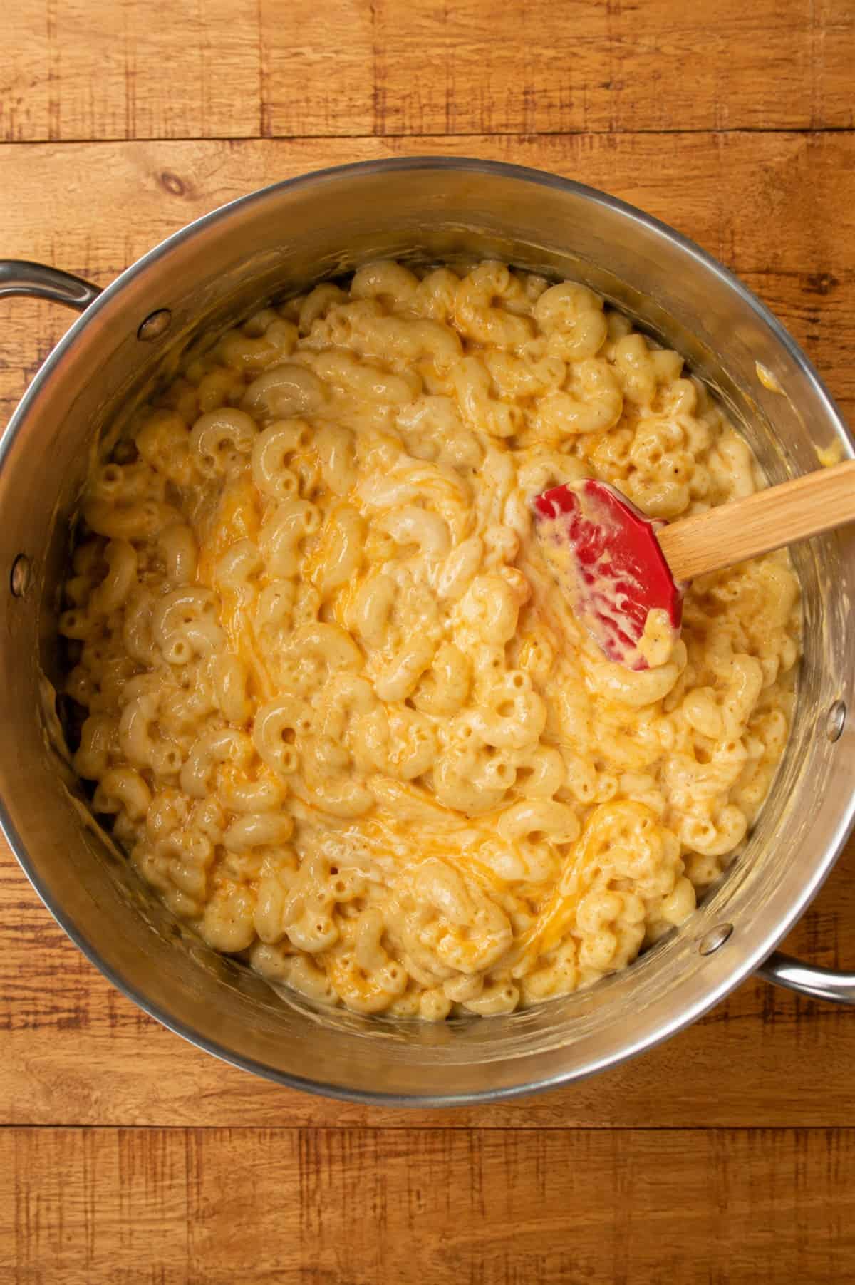 Elbow macaroni folded together with the smoked cream cheese sauce until creamy and fully coated.