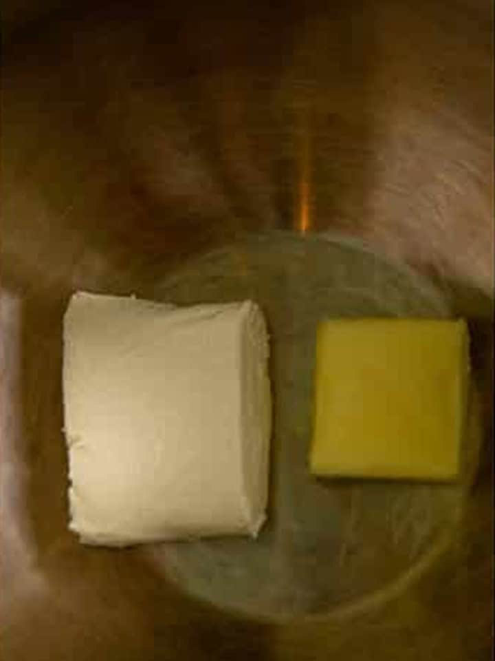 Cream cheese and butter in a mixing bowl to start the Chicken Crescent Rolls filling.
