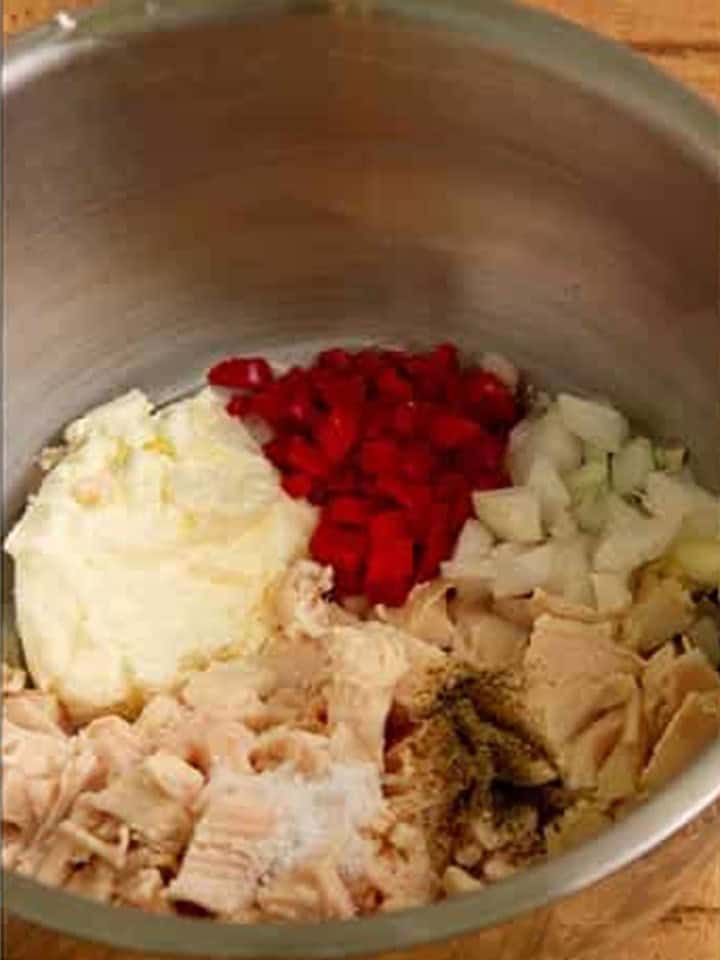 Cubed chicken, onions, pimientos, and seasonings added to the cream cheese mixture.
