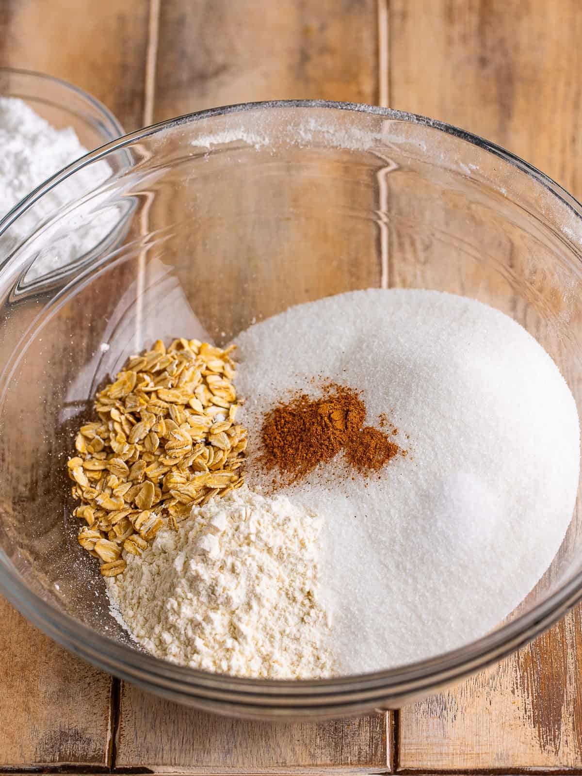 Sugar, flour, rolled oats and pumpkin pie spice in a bowl for the streusel topping.