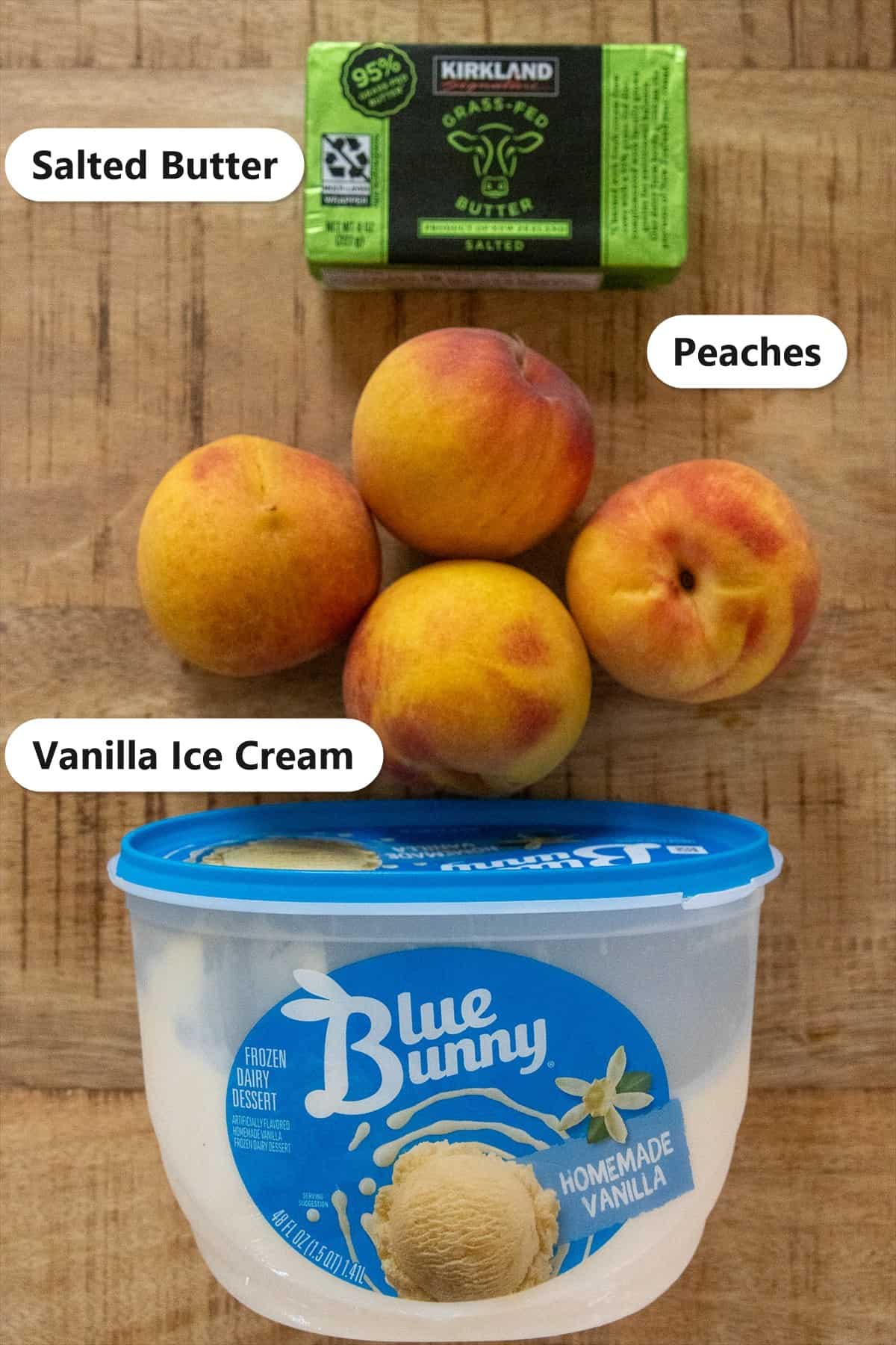 Labeled ingredients for grilled peaches including fresh peaches, salted butter, and vanilla ice cream.