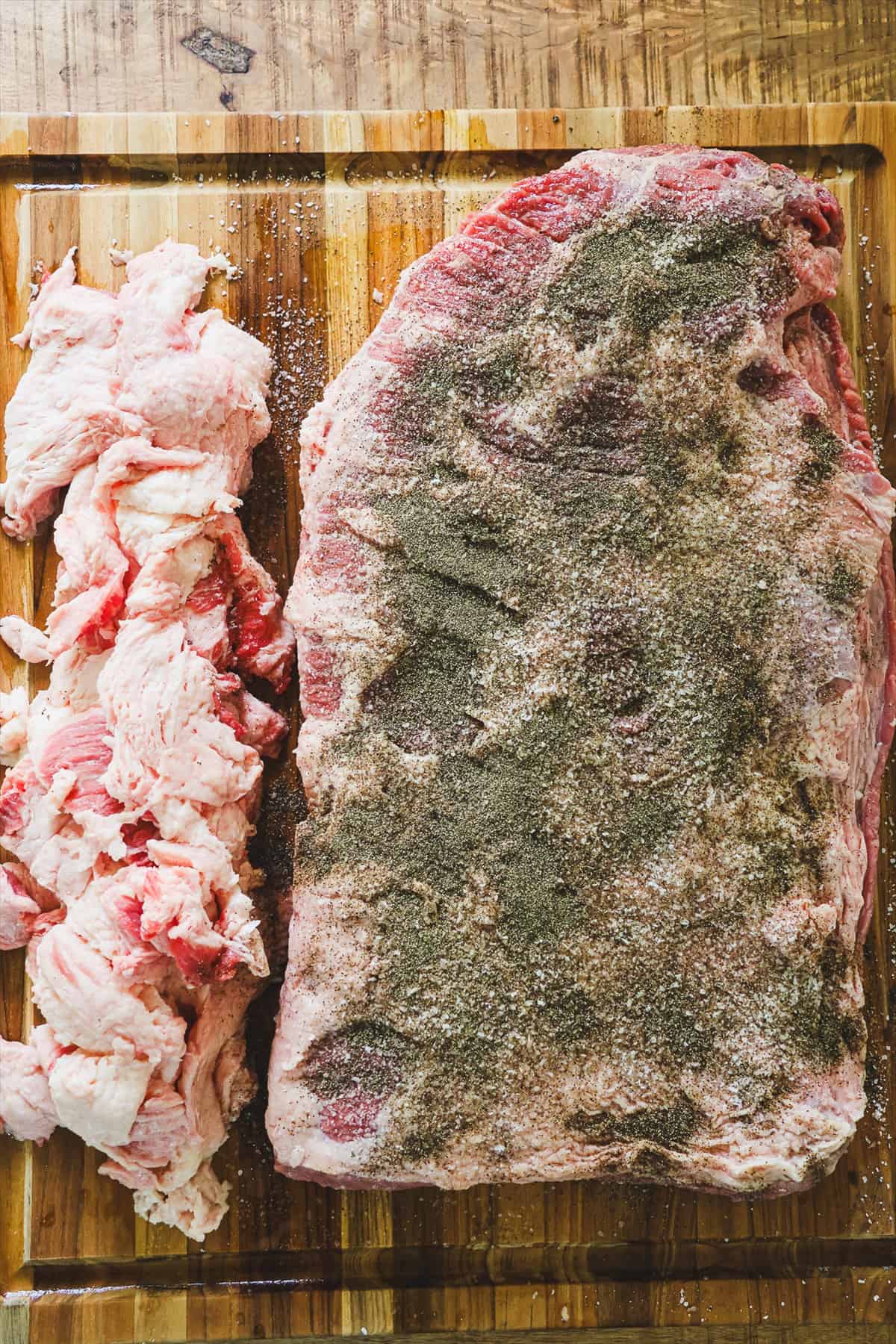 Brisket coated in a heavy layer of kosher salt and black pepper rub.