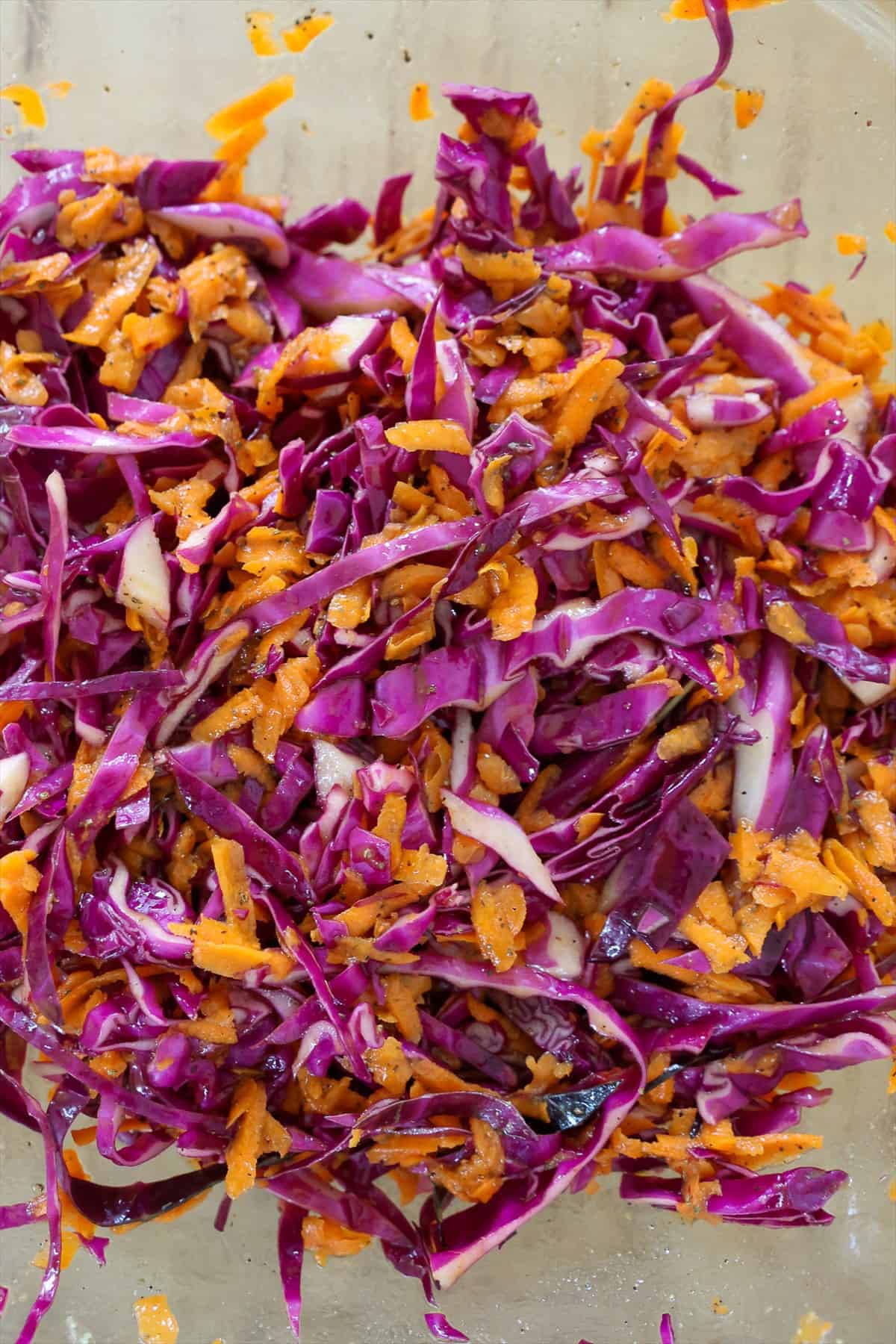 Red cabbage and carrots tossed with tangy vinegar dressing until evenly coated.